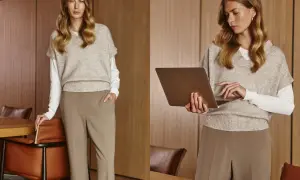 Elegancka kobieta w stylizacji business casual, z laptopem w dłoniach, gotowa do pracy.