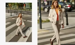 Elegancka beżowa marynarka damska w połączeniu z jasnymi spodniami i pomarańczową bluzką tworzy stylowy miejski look.