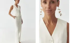 Elegancka biała kamizelka i spodnie tworzą stylowy komplet. Długie, złote kolczyki dodają szyku. Biała kamizelka stylizacje na co dzień i od święta.