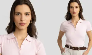 Kobieta w różowej koszulce polo, z brązowym paskiem i beżowymi spodniami. Dowiedz się, jak nosić koszulka polo damska, by wyglądać stylowo.